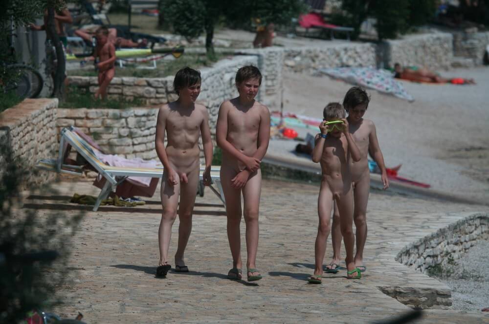 Shore walking nude - nudism and naturism