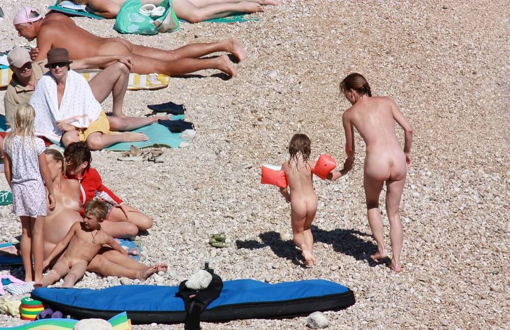 Orange Floaty Safety First Naturist pics - nudism and naturism