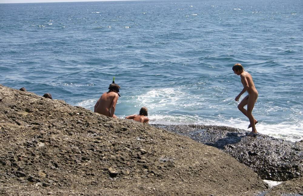 Leaning Against Hit Rocks pics - nudism and naturism